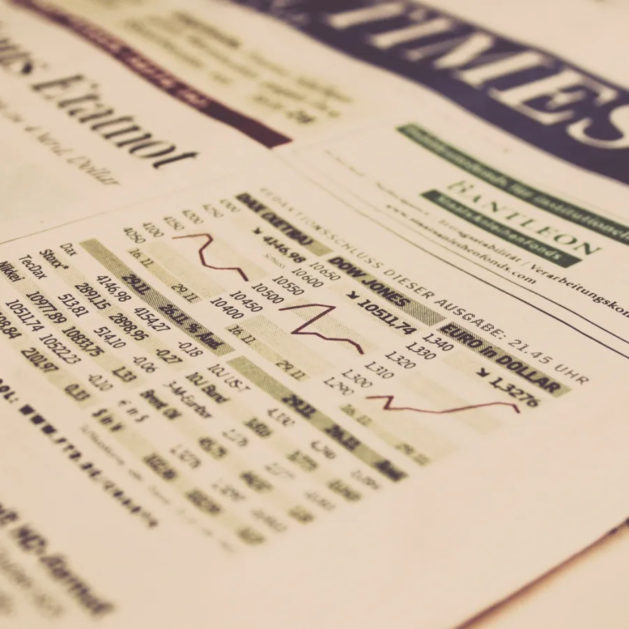 Market tables and trend lines in a financial newspaper
