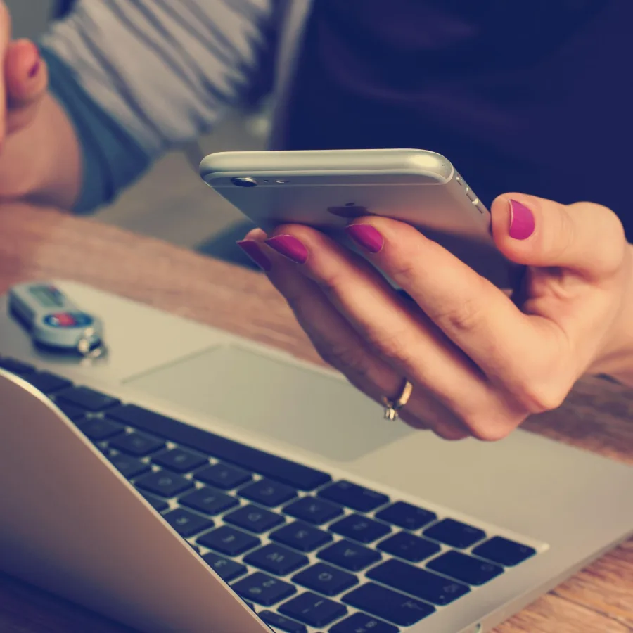 Managing finances on a phone and laptop